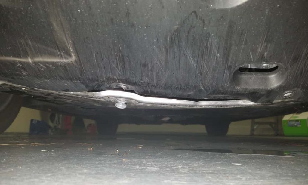 honda civic metal plate under car