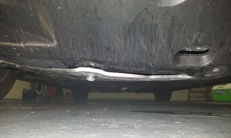 honda civic metal plate under car